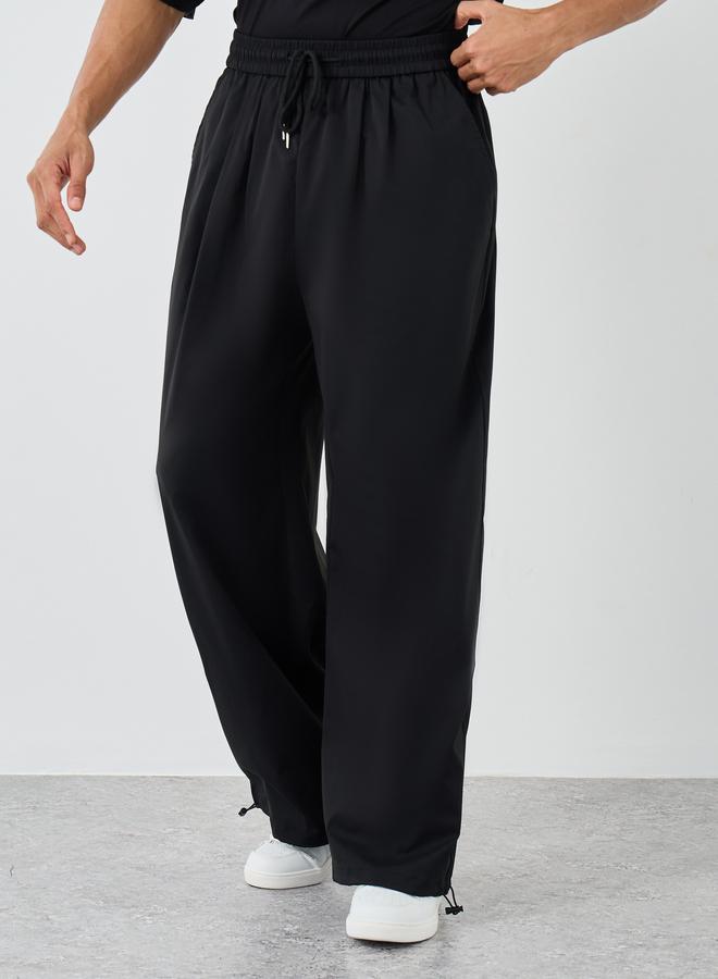 Styli Men Black Casual Baggy Parachute Pants - Image 1