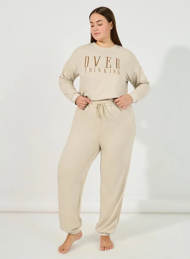 Styli Plus Size Overthinking Slogan Sweatshirt & Jogger Lounge Set