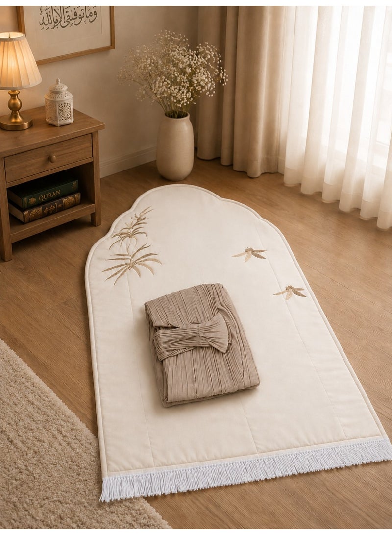 The Palm Prayer Set is a distinctive set consisting of a prayer rug with a foam lining in the shape of a mihrab, and a plain prayer garment with pleats and an attached headscarf. One large size for women.