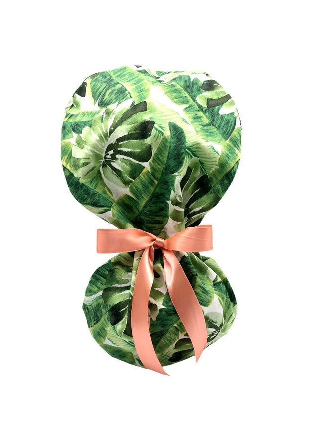 Generic Ponytail Scrub Cap, dramatic tropical green leaves print. Select satin ribbon tie backs from 5 color options. - Image 1