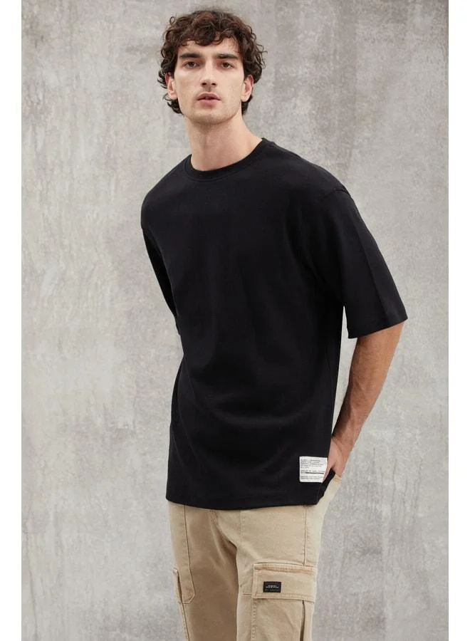 Grimelange Joel Men's 100% Organic Cotton Thick Fabric Special Textured Label Detailed Oversize Black T‑shirt.