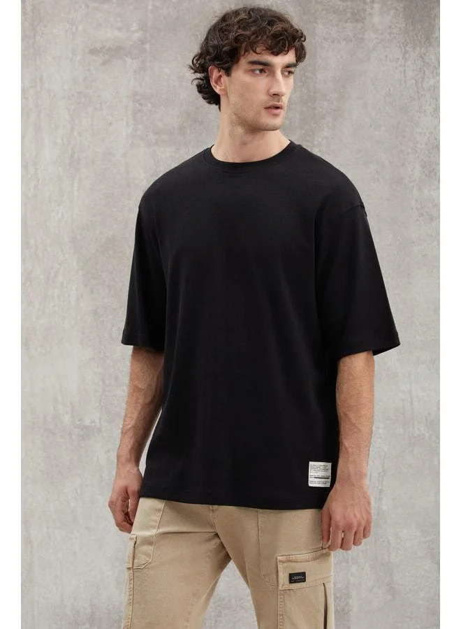 Grimelange Joel Men's 100% Organic Cotton Thick Fabric Special Textured Label Detailed Oversize Black T‑shirt.