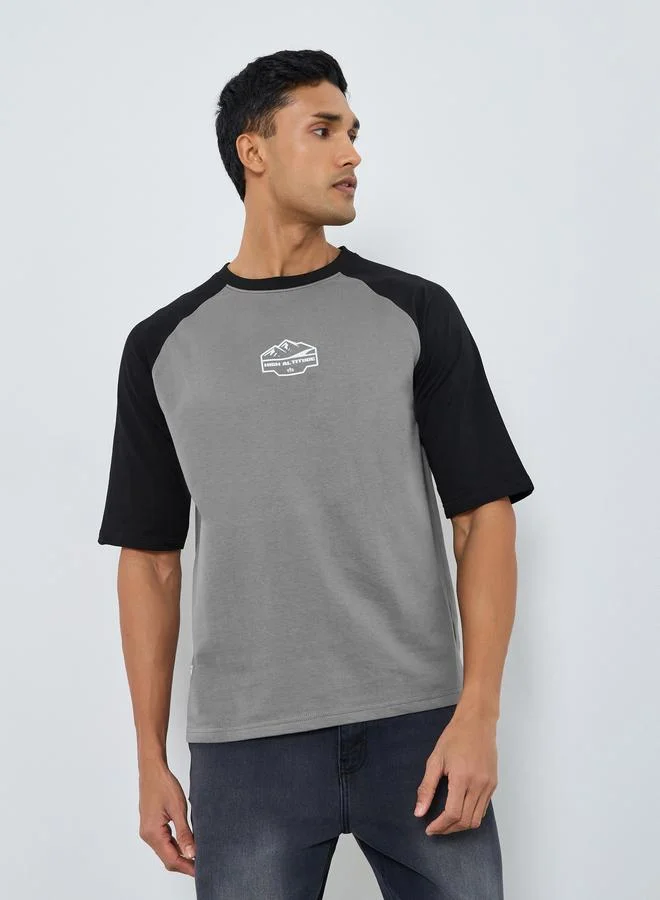 Styli Men Oversized Raglan Sleeve Printed T-Shirt