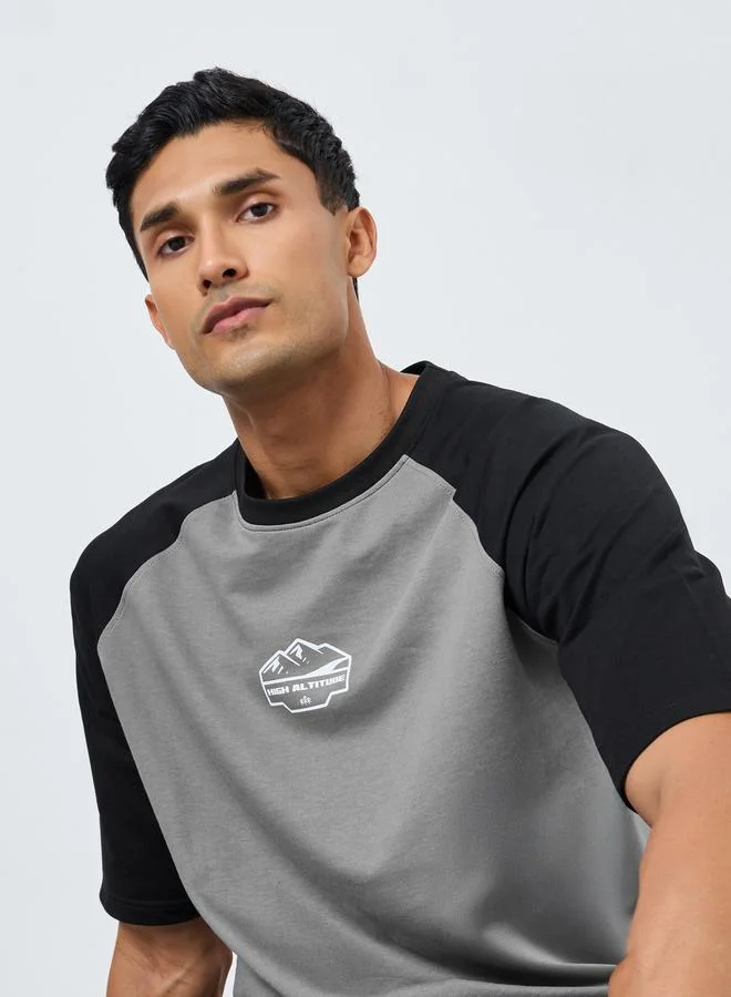 Styli Men Oversized Raglan Sleeve Printed T-Shirt