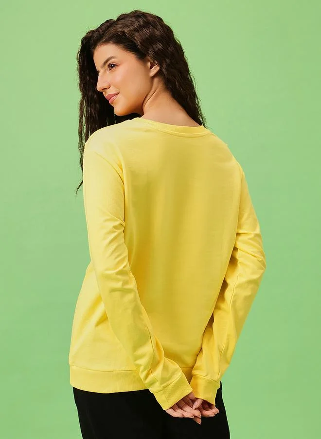 Clovia  Pluto Print Light Yellow Cotton Sweatshirt for Women | Best Price UAE
