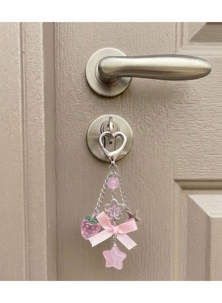 Nevara Stylish keychain with a cute pink design, featuring a heart-shaped clasp and various decorative charms that add a trendy and feminine touch. - Image 2