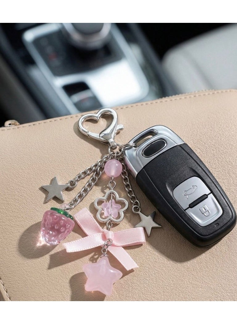 Nevara Stylish keychain with a cute pink design, featuring a heart-shaped clasp and various decorative charms that add a trendy and feminine touch. - Image 4