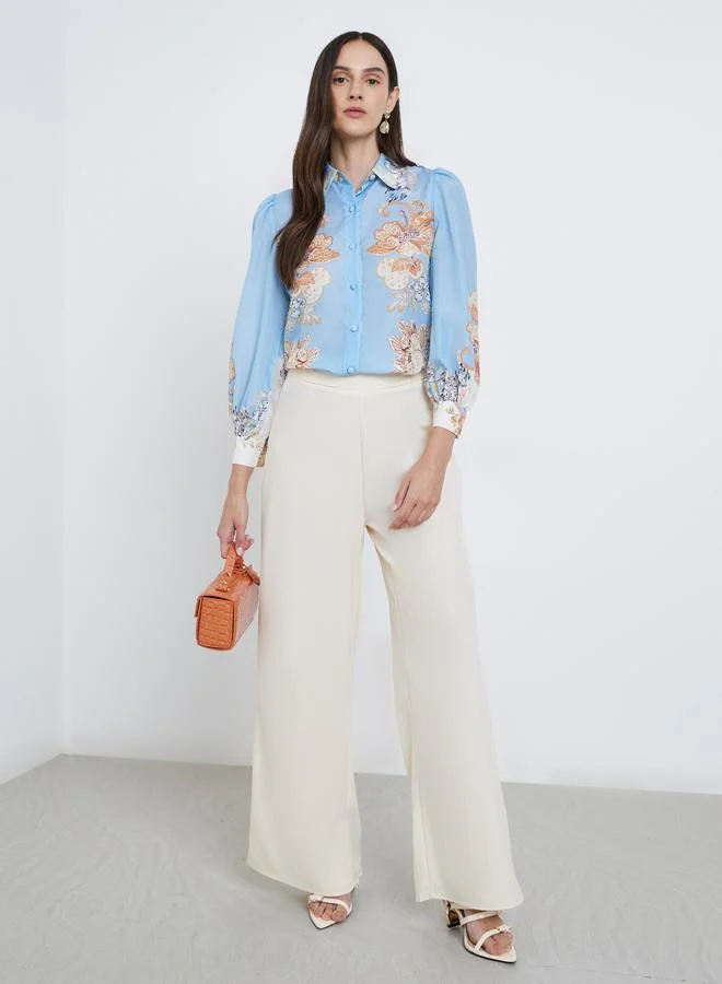 ستايلي بلوزة بطبعة زهور مع تفاصيل أزرار