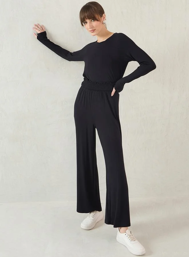 Femmella Femmella Black Smocked Waistband Flared Knit Pants