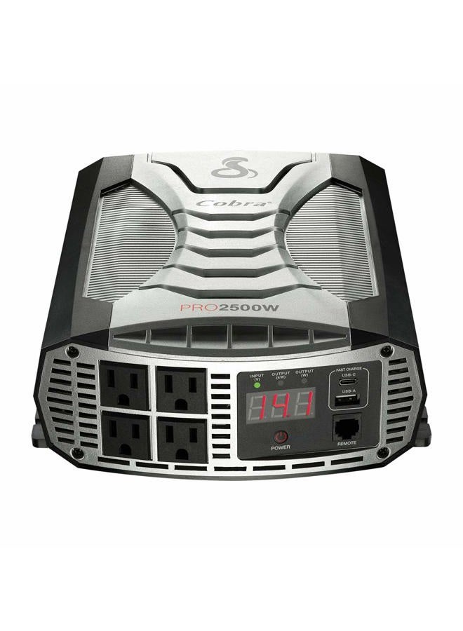 Cobra محول طاقة احترافي PRO 2500W، محمول – شاحن سيارة 2500 واط، 4 مآخذ AC مؤرضة، 2 منفذ USB للشحن السريع وجهاز تحكم عن بعد (CPIALCDG1) متوافق - Image 1