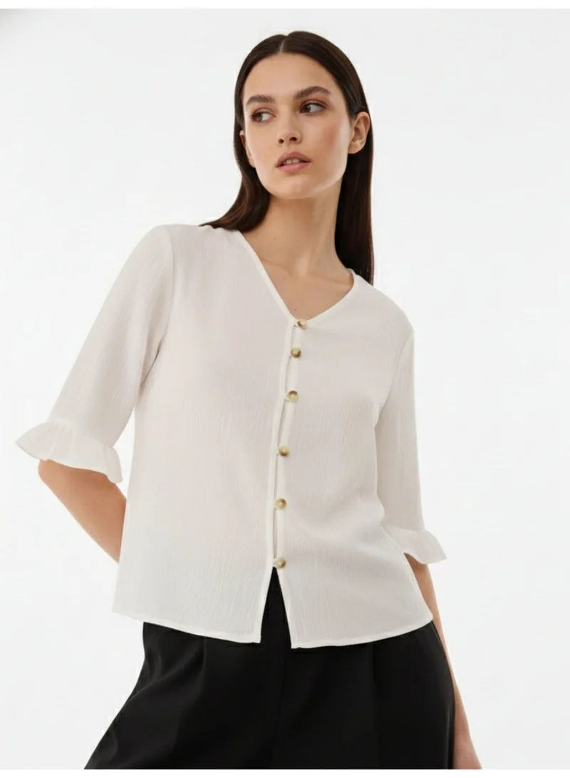Outzidr  White Front Buttoned Top With Ruffle Detail On Sleeve for Women | Best Price UAE