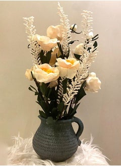 An elegant artificial yellow flower vase in a gray pot. An attractive look for your home.