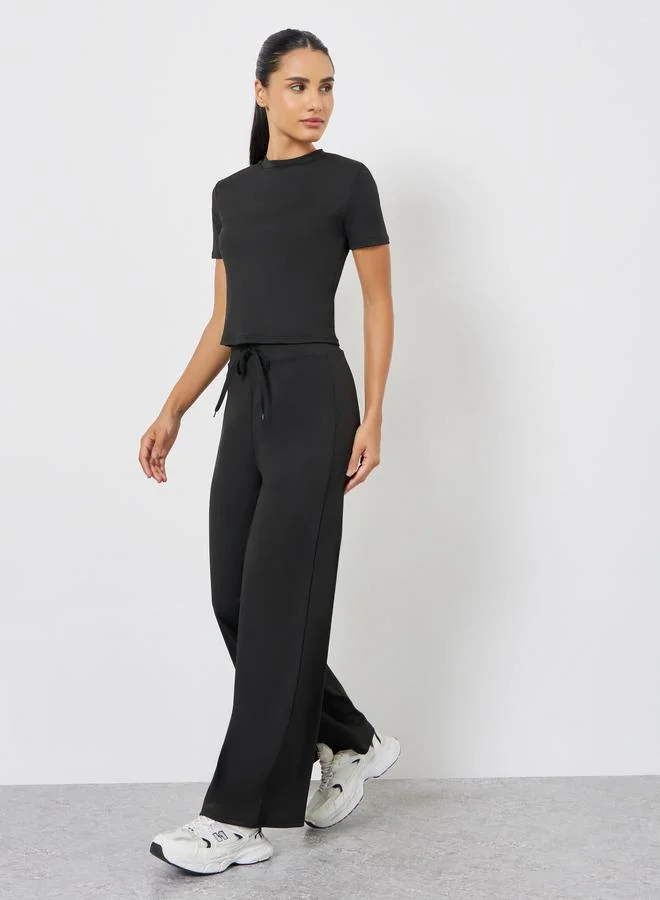 Styli Active Solid Crop Top and Drawstring Loose Pants Set