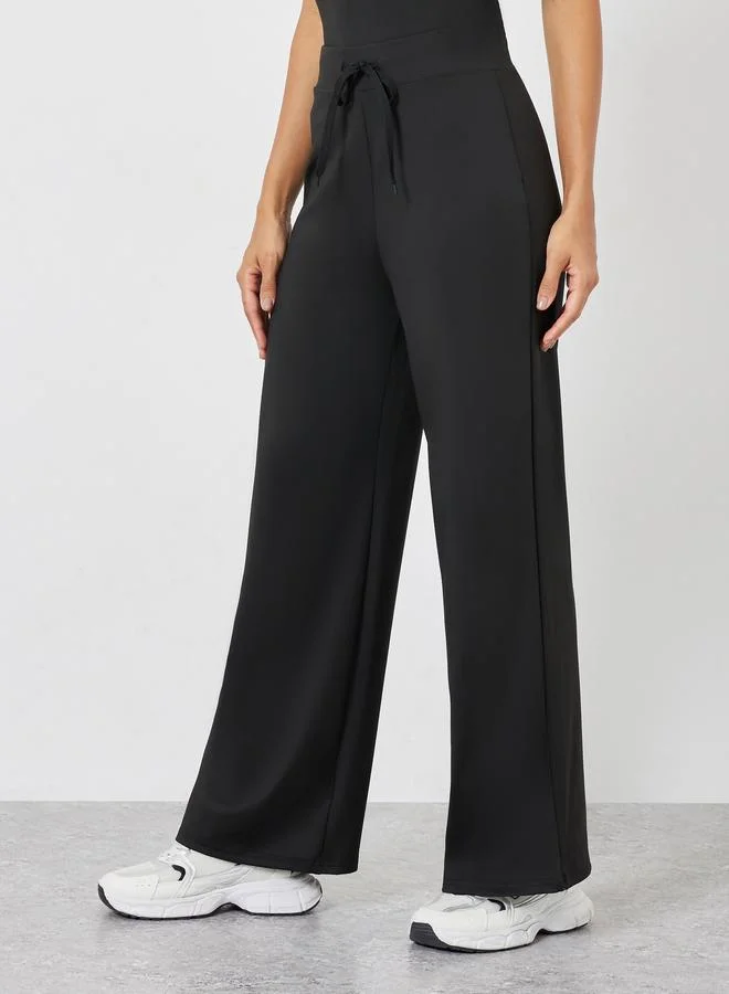 Styli Active  Solid Crop Top and Drawstring Loose Pants Set for Women | Best Price UAE