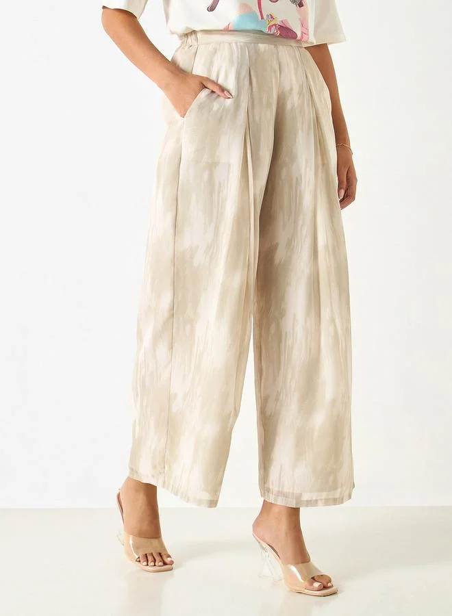 ايكونيك بنطلون واسع الساقين بخصر نصف مطاطي وطبعات من آيكونيك