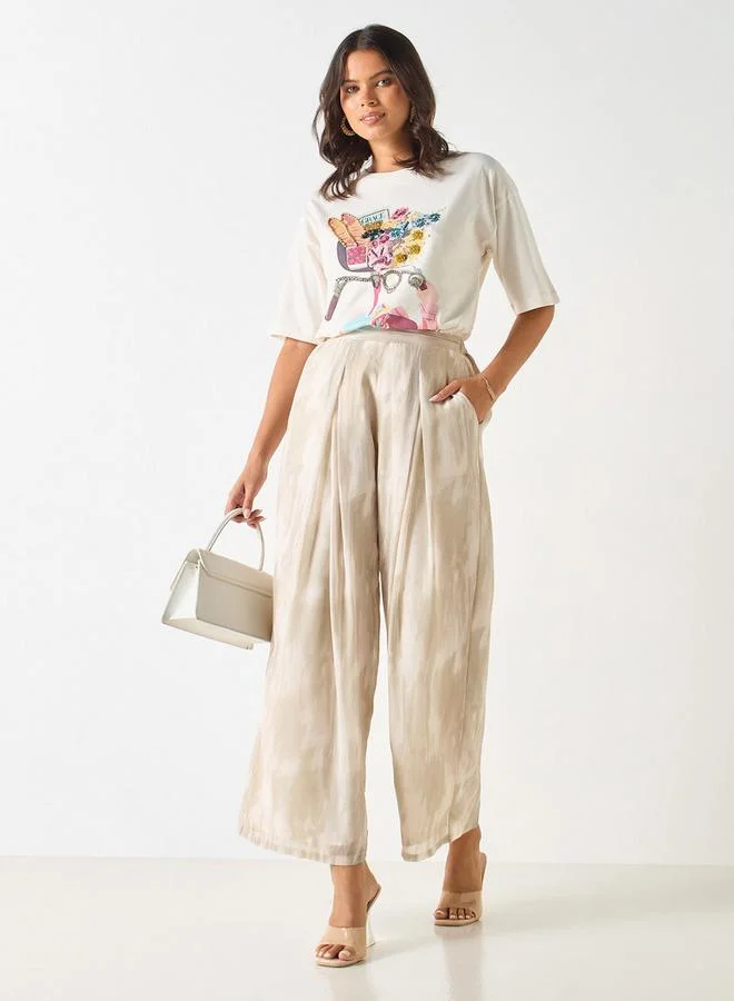 ايكونيك بنطلون واسع الساقين بخصر نصف مطاطي وطبعات من آيكونيك