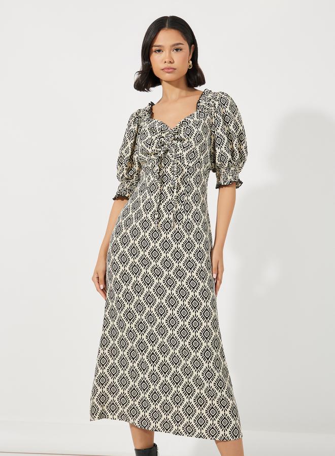 ستايلي فستان ميدي مطبع بالكامل مع تفاصيل مزمومة - Image 5