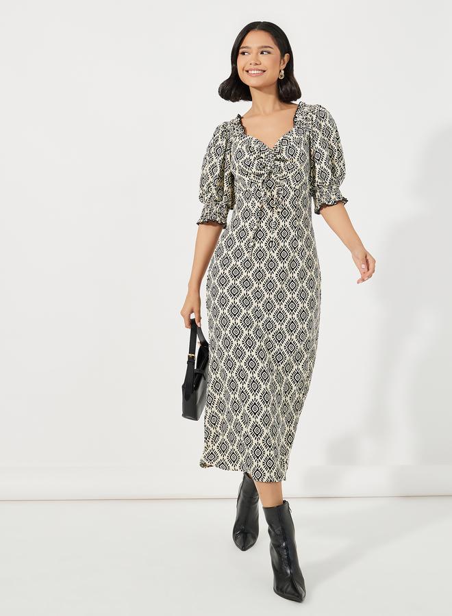 ستايلي فستان ميدي مطبع بالكامل مع تفاصيل مزمومة - Image 4