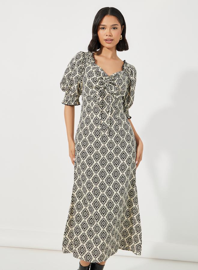 ستايلي فستان ميدي مطبع بالكامل مع تفاصيل مزمومة - Image 2