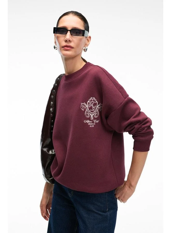 GRIMELANGE AUDRA Women's Oversized Round Neck Sweatshirt with Embroidery Detail in Burgundy.