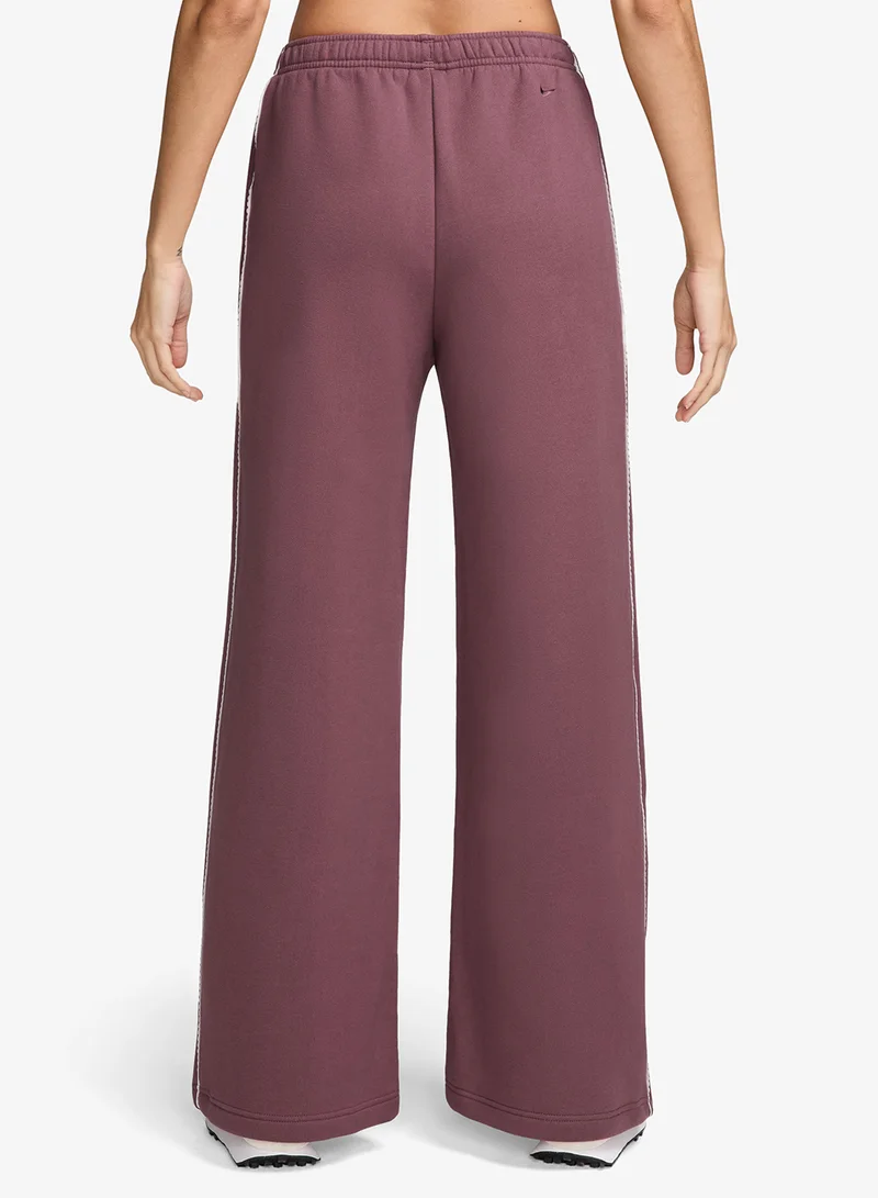 Nike PINK SMOKE/SAIL/(PINK SMOKE) Standard Fit Mid-Rise Wide-Leg Pants for Women | Best Price UAE
