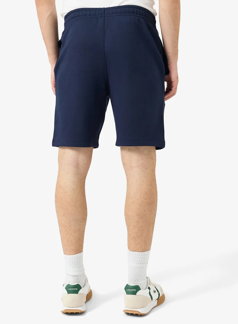 LACOSTE  Regular Fit Embossed Unbrushed Fleece Shorts for Men | Best Price UAE