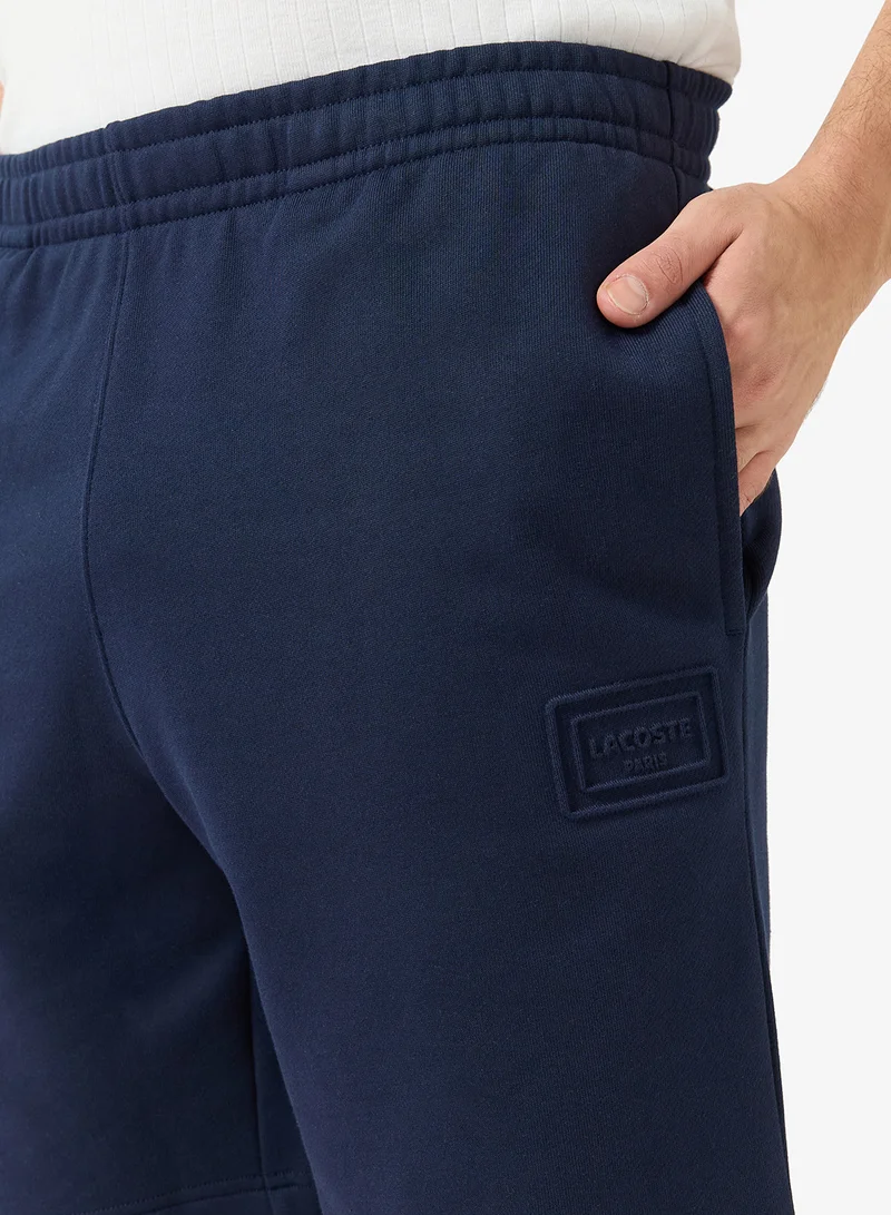 LACOSTE  Regular Fit Embossed Unbrushed Fleece Shorts for Men | Best Price UAE