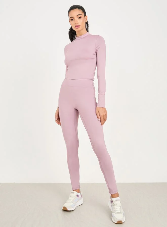 Styli High Neck Multi Panel Keyhole Back Long Sleeve Crop Top & Legging Set