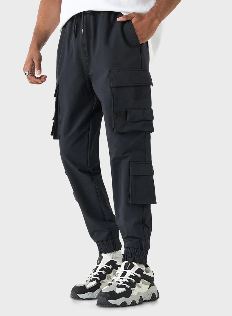SP Characters Logo Embossed Relaxed Fit Pants