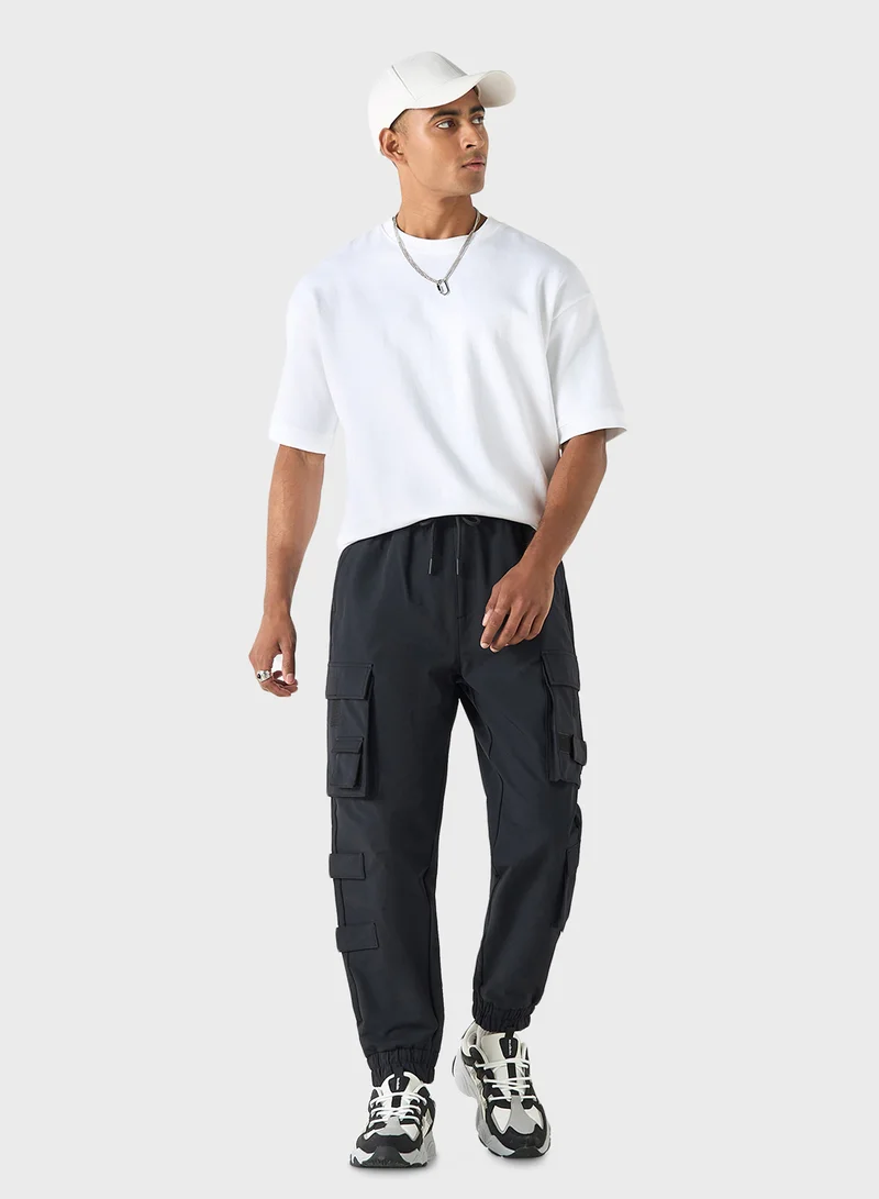 SP Characters Logo Embossed Relaxed Fit Pants