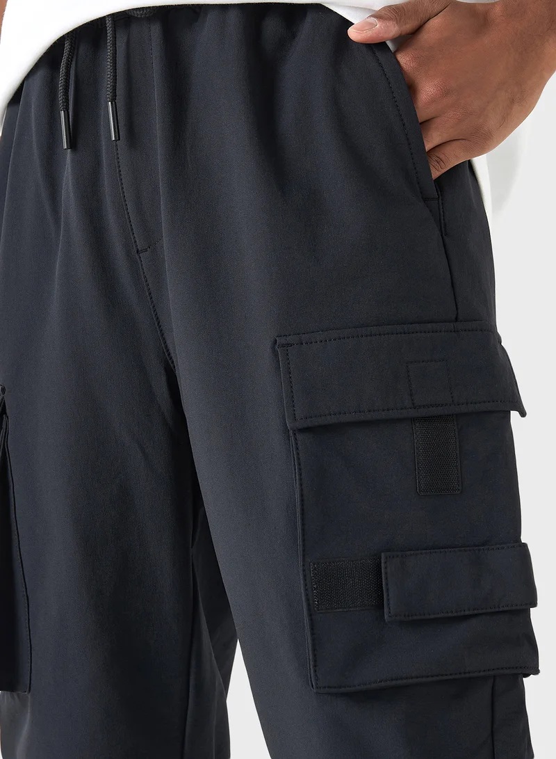 SP Characters Logo Embossed Relaxed Fit Pants