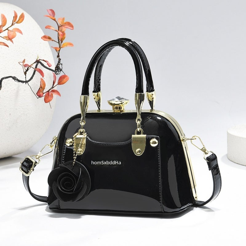 Steel armor mini shell bag, suitable for casual fashion, shiny surface, equipped with floral charm pendant, multi-functional handbag or cross-body bag, fashionable classic, lightweight and durable design
