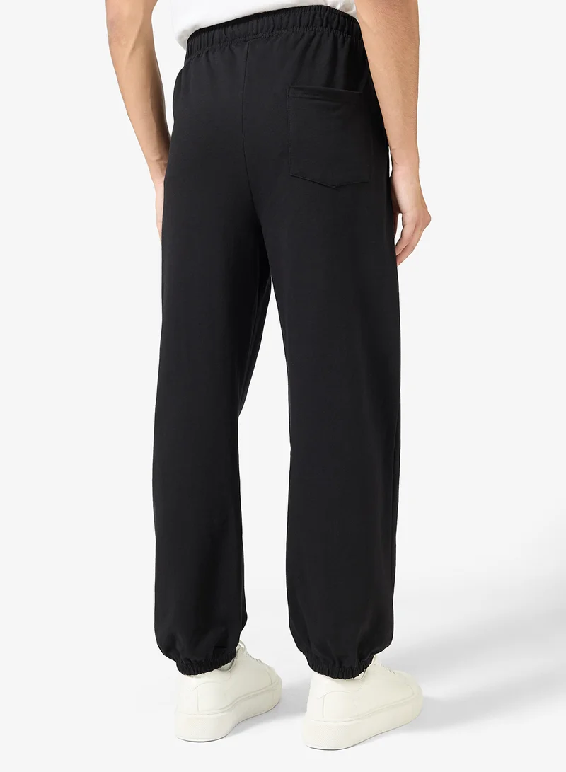 Seventy Five  Badge Detail Relaxed Oversized Joggers for Men | Best Price UAE