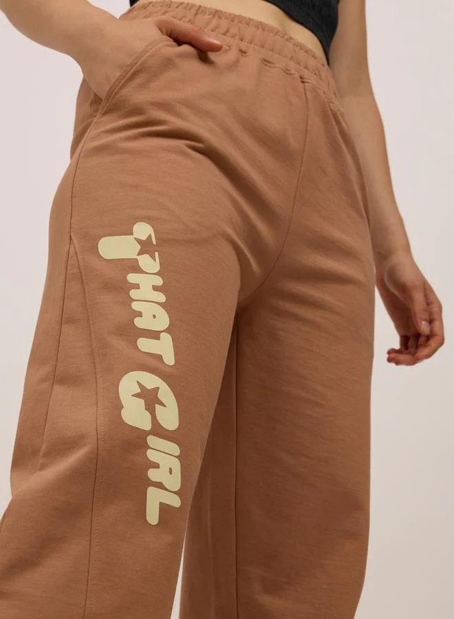 Outzidr  Brown Side Cut And Sew Printed Joggers for Women | Best Price UAE