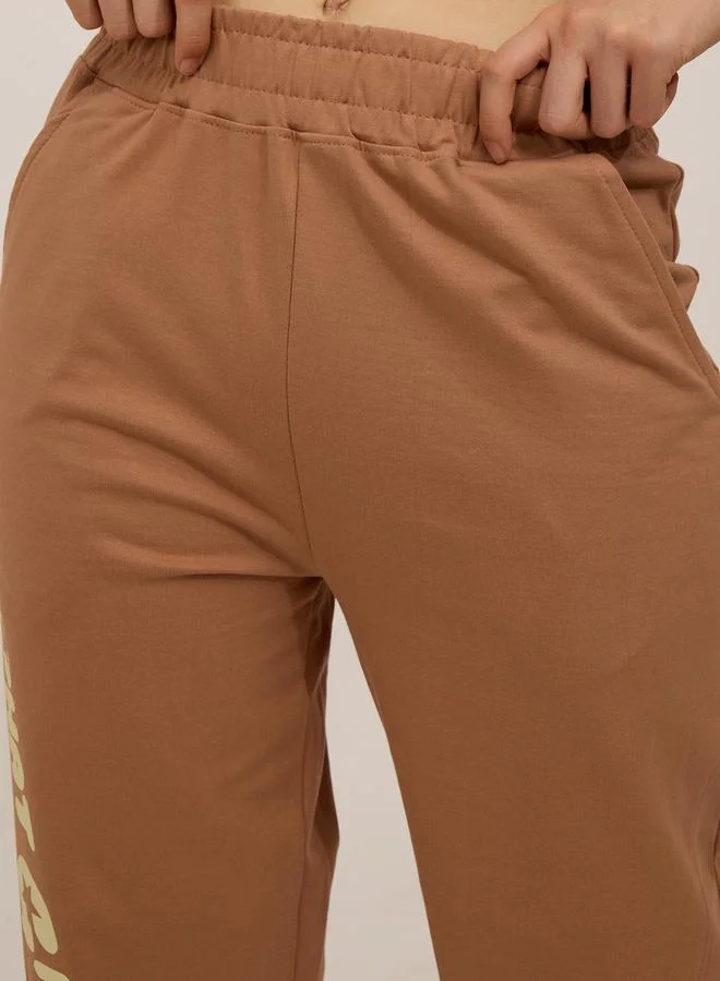 Outzidr  Brown Side Cut And Sew Printed Joggers for Women | Best Price UAE