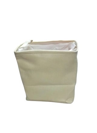 Multi-use canvas storage bag, made of high-quality material in an elegant beige colour. It features a square design with a white inner lining for easy cleaning and protection from dust. Equipped with a side handle for easy carrying and transport. Perfect for organizing clothes, toys, household items, or any other supplies. Adds a tidy and elegant touch to any home or office space. - pzsku/Z39251AC274B4F4A719FDZ/45/_/1740154480/4bb4cc50-3748-4280-be9f-7168c3bd2747