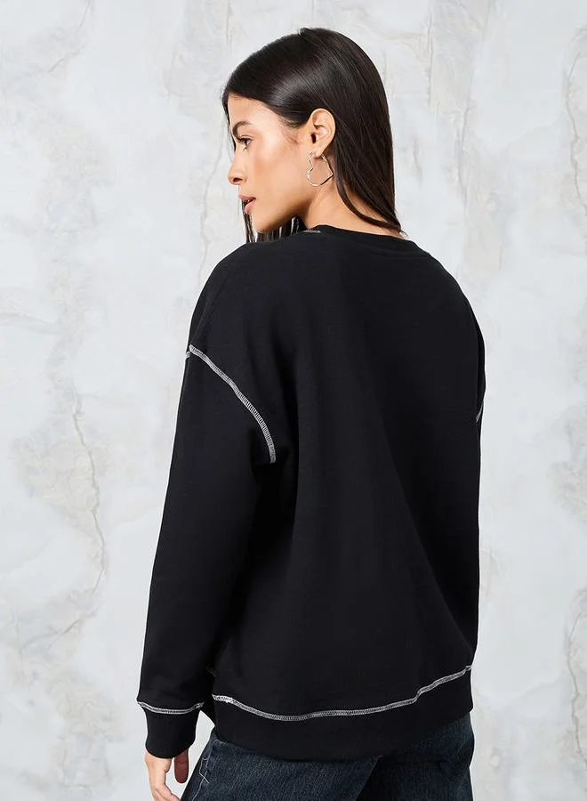 Styli Oversized Embroidered Slogan Sweatshirt with Contrast Stitch