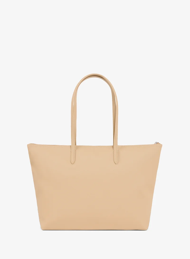 Lacoste  The iconic L1212 style in a large shopping bag for Women | Best Price UAE