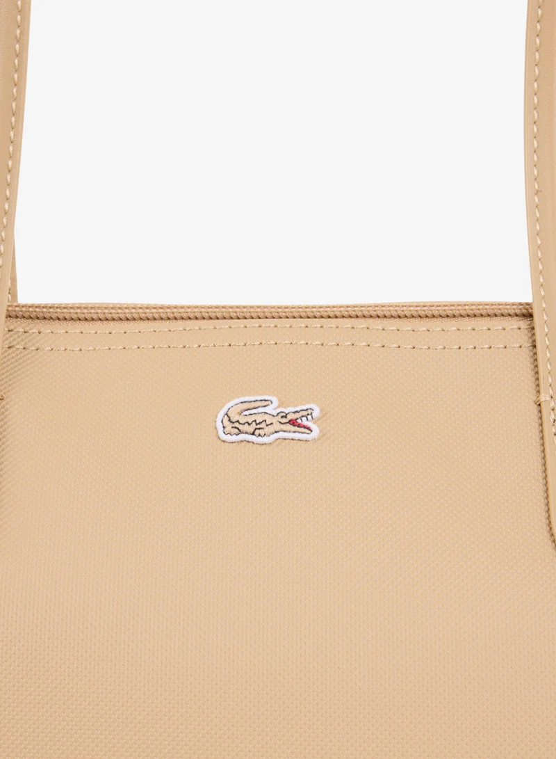 Lacoste  The iconic L1212 style in a large shopping bag for Women | Best Price UAE
