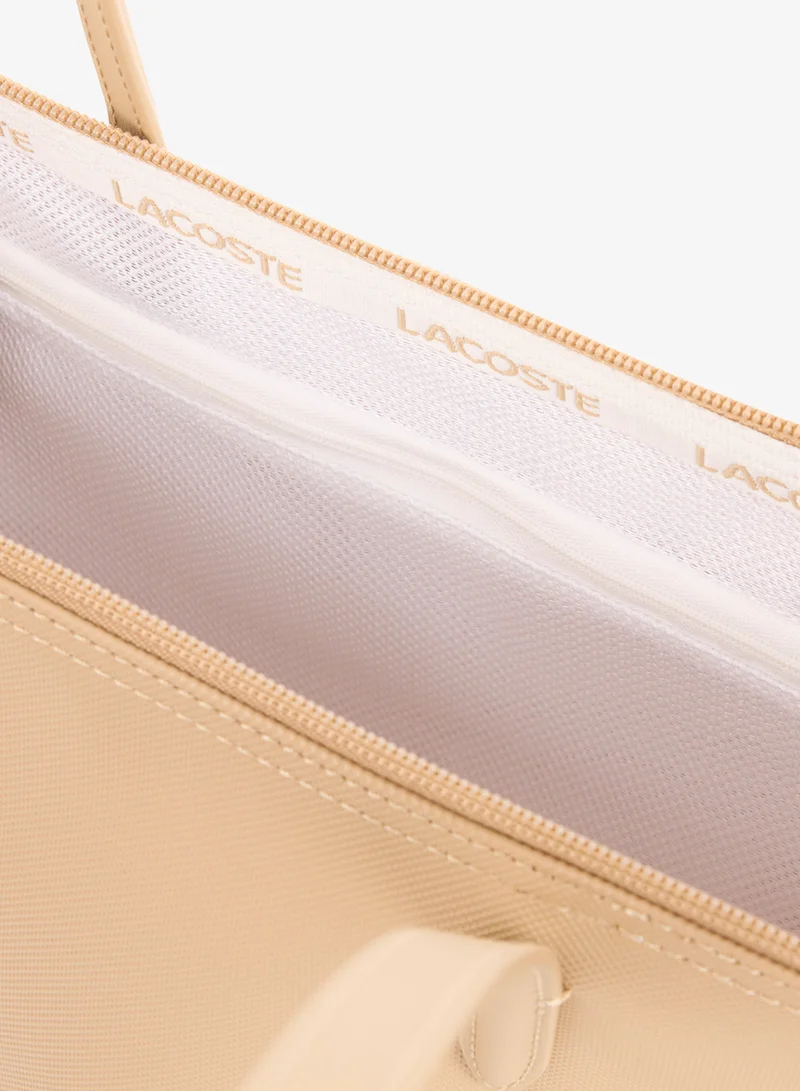 Lacoste  The iconic L1212 style in a large shopping bag for Women | Best Price UAE