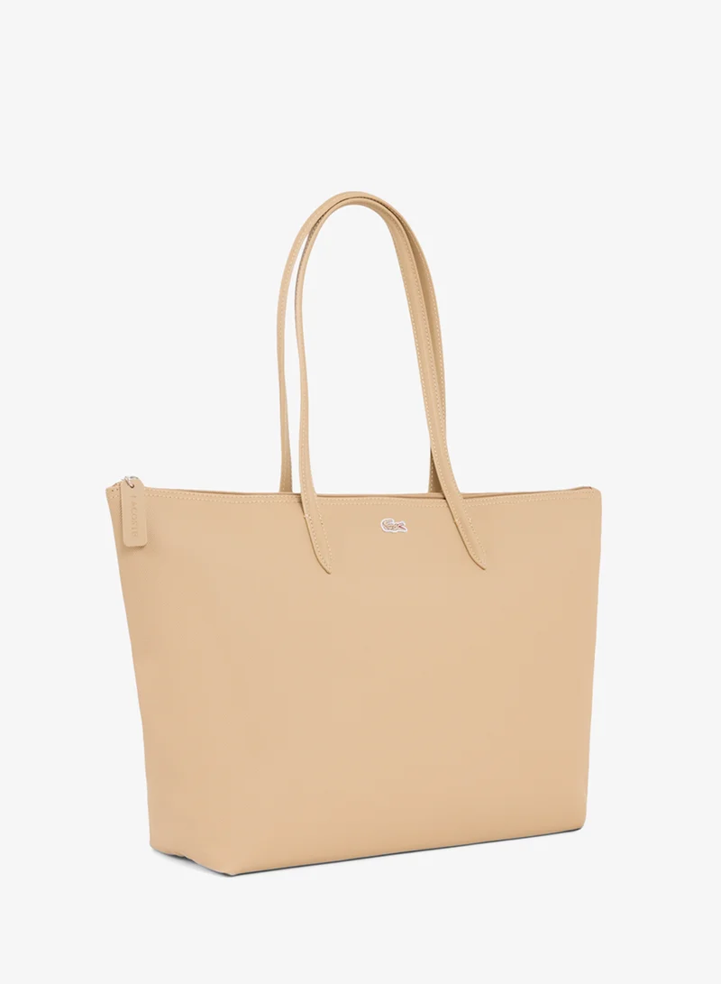 Lacoste  The iconic L1212 style in a large shopping bag for Women | Best Price UAE