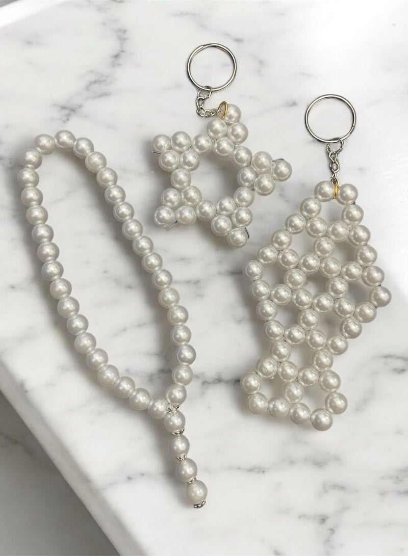 White Islamic prayer beads with 33 beads, along with a gift of a lantern and a star. - Image 1