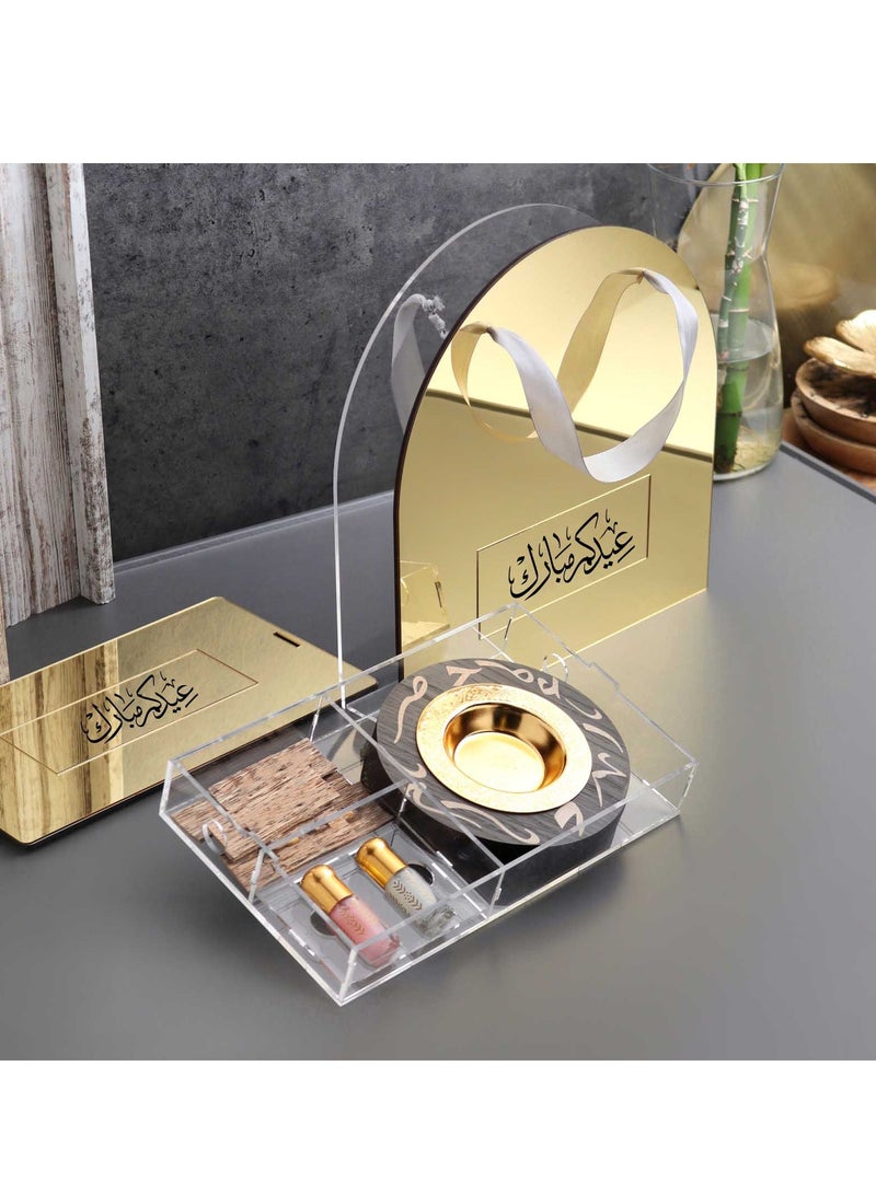 Story Of Candle An Incense Burner with Distinctive Arabic Engravings, a Luxurious Bag Made of White and Transparent Acrylic, a Box Containing Natural Oud Chips, and two Packages of a Quarter Tola of Luxurious Musk. - Image 1
