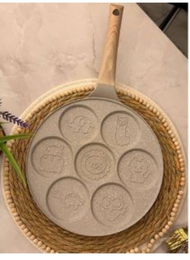 Multi-cavity pancake pan with a round design and wooden handle – suitable for making pancakes and eggs.