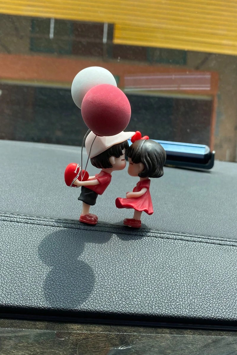 Car Decoration – A Set of 2 Romantic Car Dashboard Ornaments Featuring a Boy and Girl with Balloons. A cute and romantic design that adds a special touch to your car interior. Perfect as a gift for Valentine's Day, anniversaries, or birthdays for someone you love. - Image 4