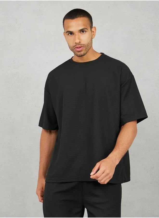 ستايلي Solid Textured Knit Oversized Streetwear T-Shirt & Shorts Set