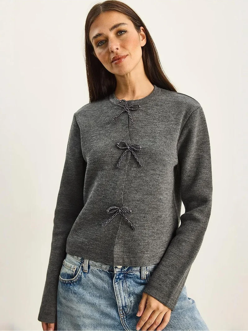 بيانكو لوتشي كارديجان محبوك بياقة دائرية وتفاصيل فيونكة