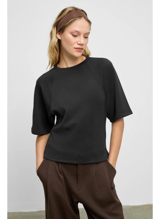 Grimelange JOLIEZA Women's Crew Neck Detailed Short Raglan Sleeve Relaxed Fit Black Blouse.