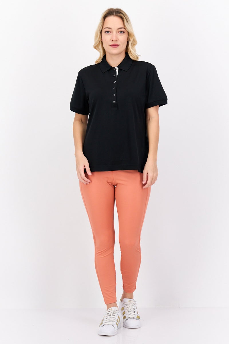 Greg Norman تي شيرت بولو تدريب قصير الأكمام للنساء، أسود - Image 2