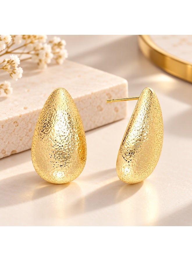 Gold teardrop-shaped screw earrings for women and girls – a stylish and modern design suitable for outings and occasions. - Image 1